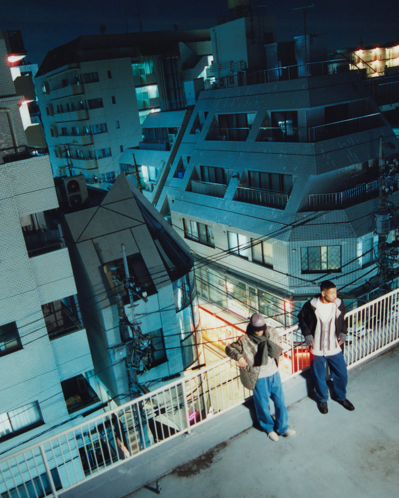 Models Standing on top of a building in Tokyo.